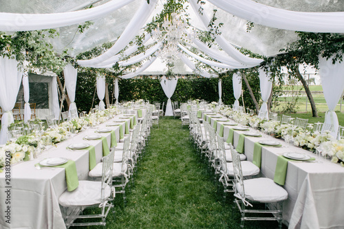 Outdoor Summer Wedding Tent Decorated With Hanging Fabric