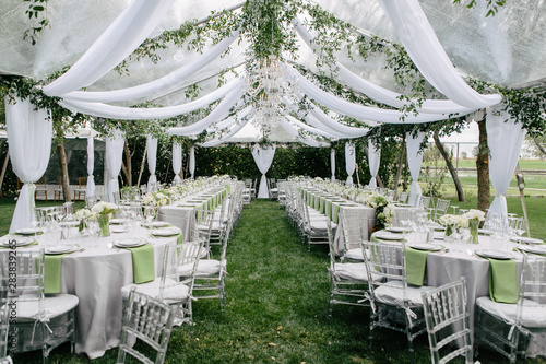 Outdoor Summer Wedding Tent Decorated With Hanging Fabric