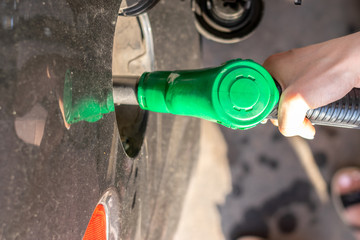 Gas nozzle. Fills petrol on gas station. Transport energy, transportation concept