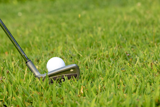 Golf Ball With A Iron Wedge, Getting Ready Or Lining Up To Hit A Golf Ball