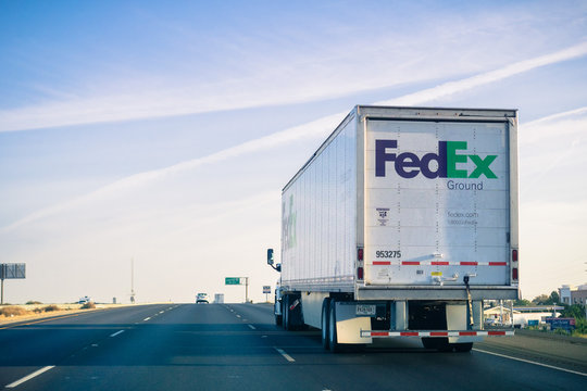 October 15, 2017 Stockton/CA/USA - FedEx Ground truck driving on the freeway on a sunny Sunday morning