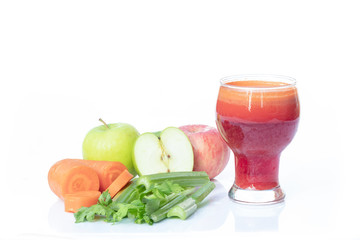 Fresh, healthy juice in a glass with carrots, apple and celery stalks, Vegetable juice isolate on...