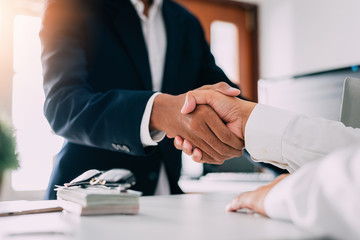 Obraz na płótnie Canvas Negotiating business,Image of businessmen Handshaking,Handshake Gesturing People Connection Deal Concept