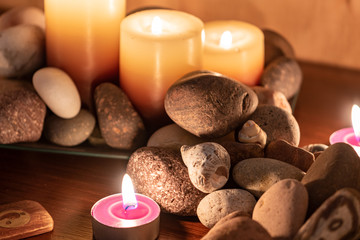 Obraz na płótnie Canvas energetic stones, soft light and aromatic candles for yoga session