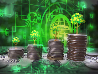 Double exposure of trees on stacked coins for economic growth finance and business technology concept. Selective focus.
