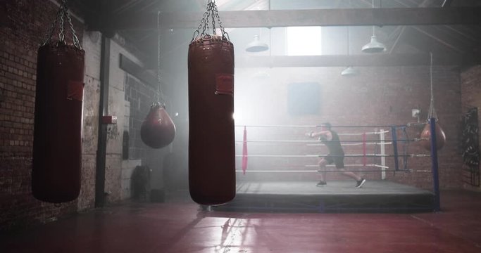 Adult male boxer stepping into the ring