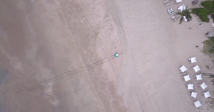 A Drone shot over a beautiful sea heading towards the trees, Goa, India.