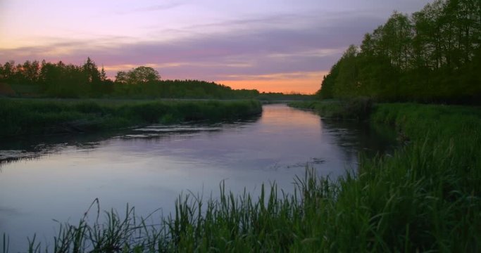 beautiful small river in sunset timelaps - Footage is delivered in rec.709. Ready for color grade or LUT.