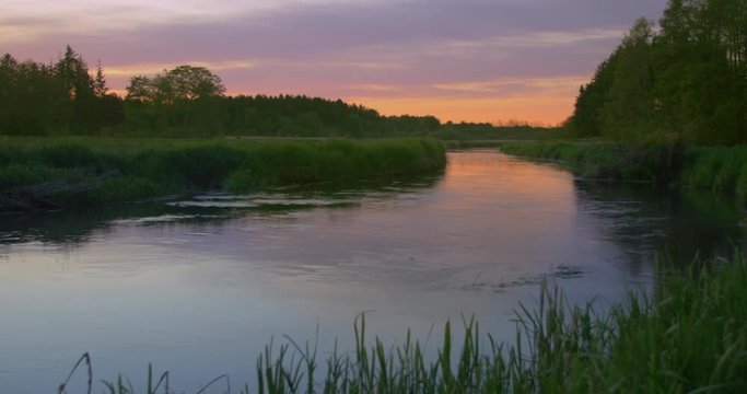 beautiful small river in sunset - Footage is delivered in rec.709. Ready for color grade or LUT.