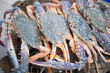 Grilled blue crabs on  charcoal