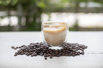 Coffee and coffee beans On the white table
