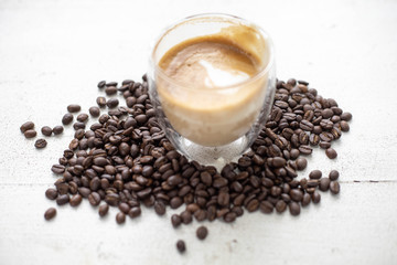 Coffee and coffee beans On the white table