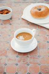 cup of coffee with bread on table in the morning with sunlight, breakfast