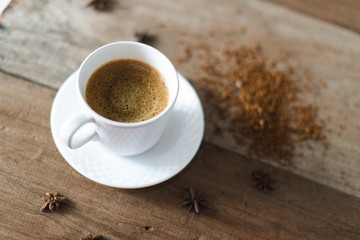 coffee cup served on table with coffee grinder