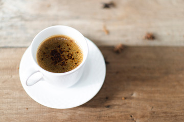 coffee cup served on table with coffee grinder