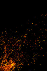 flame of fire with sparks on a black background