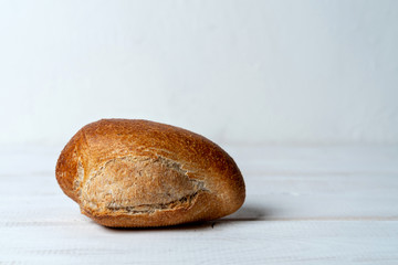 rye mini baguette on white wooden table