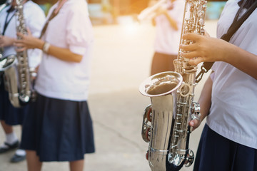 Young student Musician playing the Saxophone with Music practice of Band, Musical concept