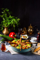 Lamb skewers with curry rice and different vegetables