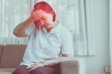 Mature asian elderly woman having migraine and headache pain,Senior healthy concept