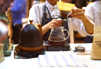 Barista drip coffee brewing in cafe or coffee shop.