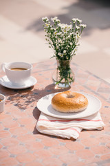 cup of coffee with bread on table in the morning with sunlight, breakfast