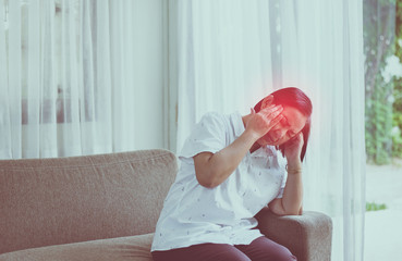 Mature asian elderly woman having migraine and headache pain,Senior healthy concept
