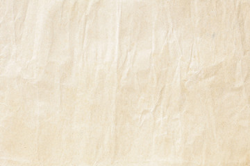 Fototapeta na wymiar Old pale brown crumpled paper background texture