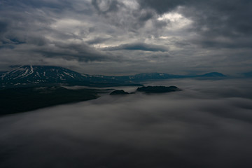 Panoramic view of the city Petropavlovsk-Kamchatsky and volcanoes: Koryaksky Volcano, Avacha Volcano, Kozelsky Volcano. Russian Far East, Kamchatka Peninsula.