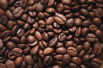 Roasted coffee beans close up for use abstract background texture