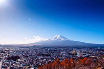 Snow covered Mount Fuji and blue sky autumn view from Chureito Pagoda park in Shimoyoshida - Fujiyoshida
