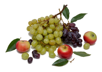 two branches of black and green grapes with red apples and leaves isolated on white background