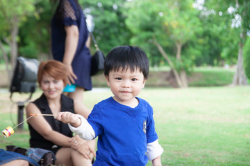 Thai boy with mom in the park