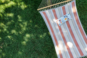 Summer garden with hanging hammock for relaxation