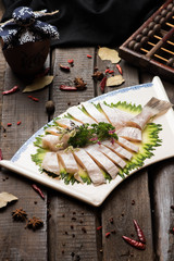 Fresh raw fish block in a white ceramic dish