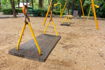 Swings in the playground Surrounded by nature