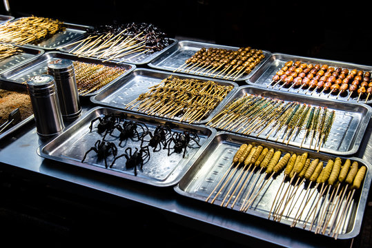 Amazing street food Roasted fried insects, scorpions, spider, centipede and bugs as snack in china