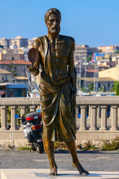 Syracuse, Sicily, Italy A Statue Of Archimedes On A Main Square. The Town Was His Birthplace.