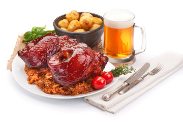 Roasted Pork knuckle with baked potatoes and dark barley beer, oktoberfest dishes, isolated on...