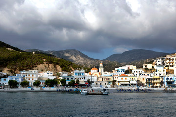 Fototapeta na wymiar Diafani village is located on north side of the island and second port in Karpathos with taverns and small cafeterias