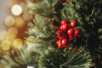 Christmas pine tree branch with decorations close up