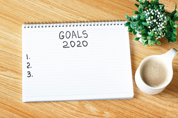 Inscription Goals 2020 in a notebook, close-up, concept of planning, setting purpose