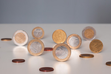 Coins standing on the table, currency concept