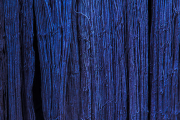 Natural Indigo dye cotton fabric, Cotton yarn dyed blue nature color, traditional fabrics of Thailand, Selective Focus  - obrazy, fototapety, plakaty