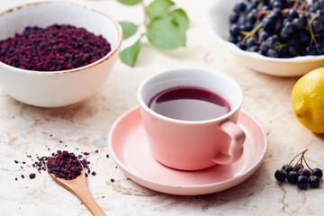 Fototapeta na wymiar Aronia berry tea in a cup