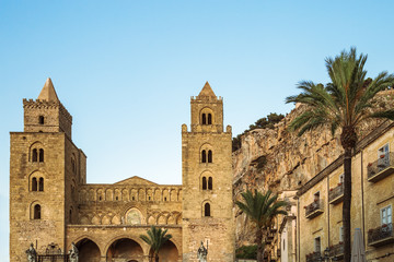 Cathedral of Cefalu, Sicily, Italy. Roman Catholic Church in small city, beautiful medieval building with towers and arches, tourist attractions.