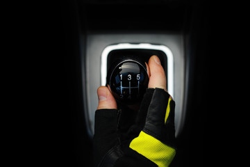 Gear lever. Manual Transmission. Hand on the gear shift in a car.