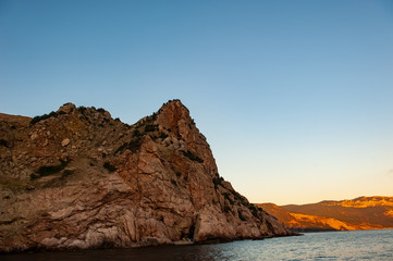 Fototapeta na wymiar sea and rocky coast in the evening. Black Sea.
