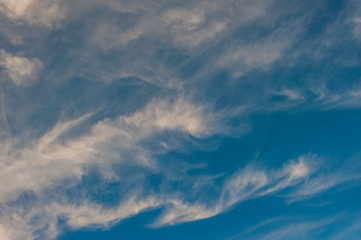 white clouds on a background of blue sky on a sunny day.