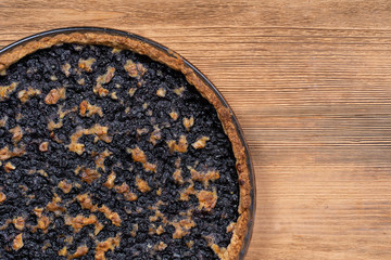Homemade organic blueberry pie dessert ready to eat, close up. Blueberry tart with walnut. Close up, copy space